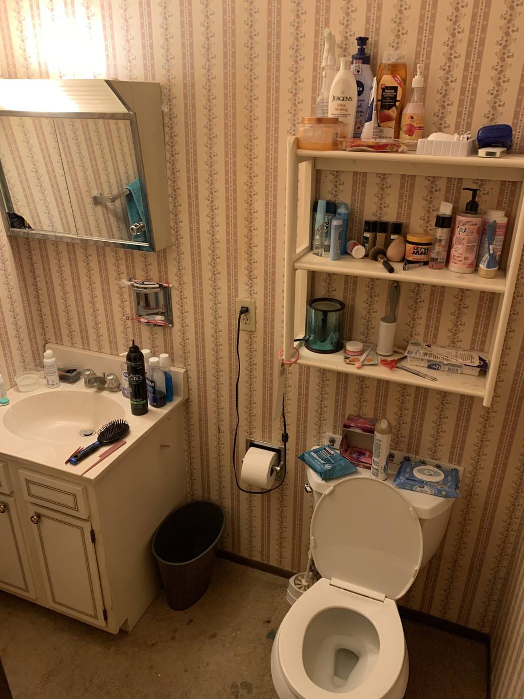 Before: Original bathroom with floral wallpaper — 15278 Montecito Granger