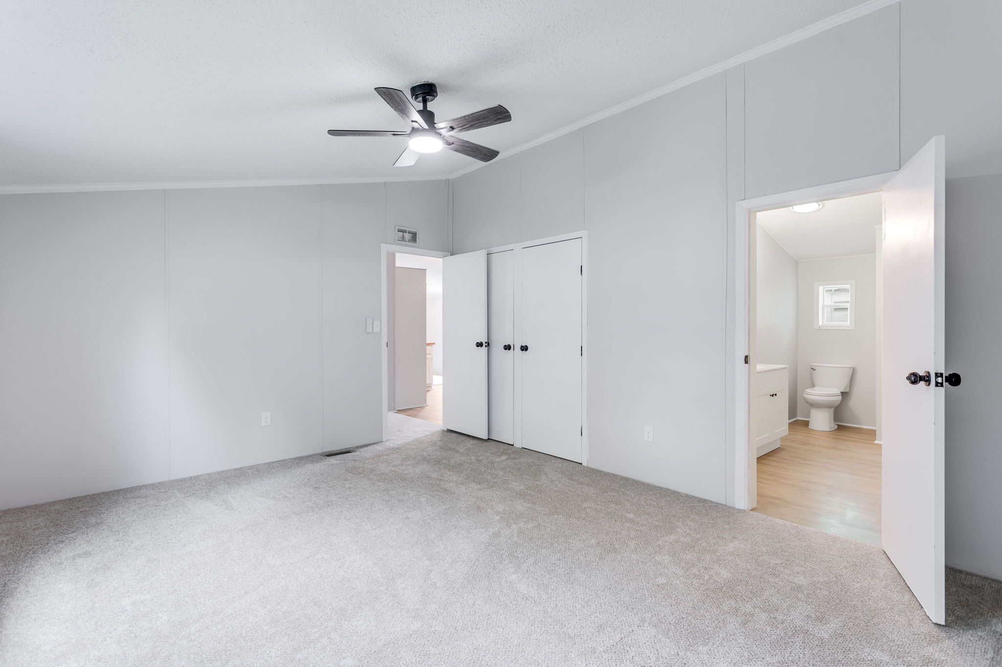 After: Primary bedroom with new carpet and en-suite — 2715 Ewing Mishawaka
