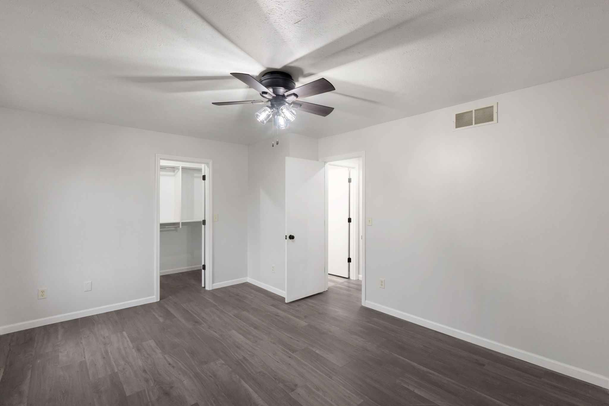 After: Renovated bedroom with new LVP flooring — 2915 Leana Goshen