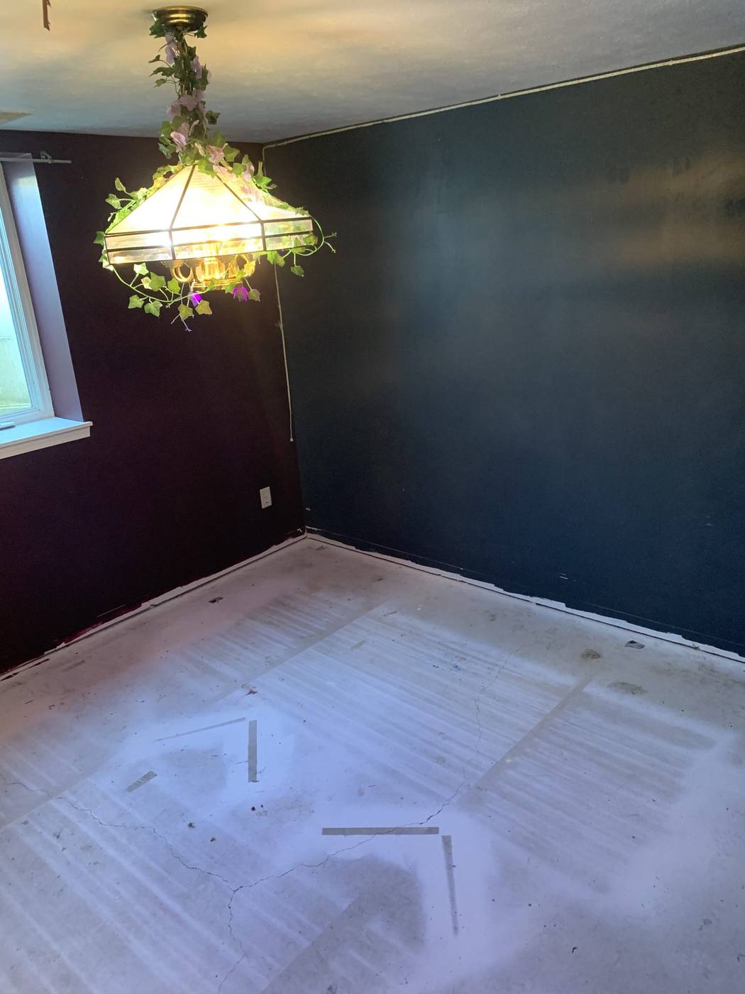 Before: Bedroom with dark paint and stripped subfloor — 2915 Leana Goshen