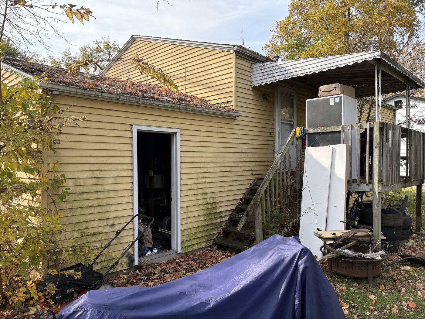 Before: Back exterior with debris โ 4920 Blackford South Bend