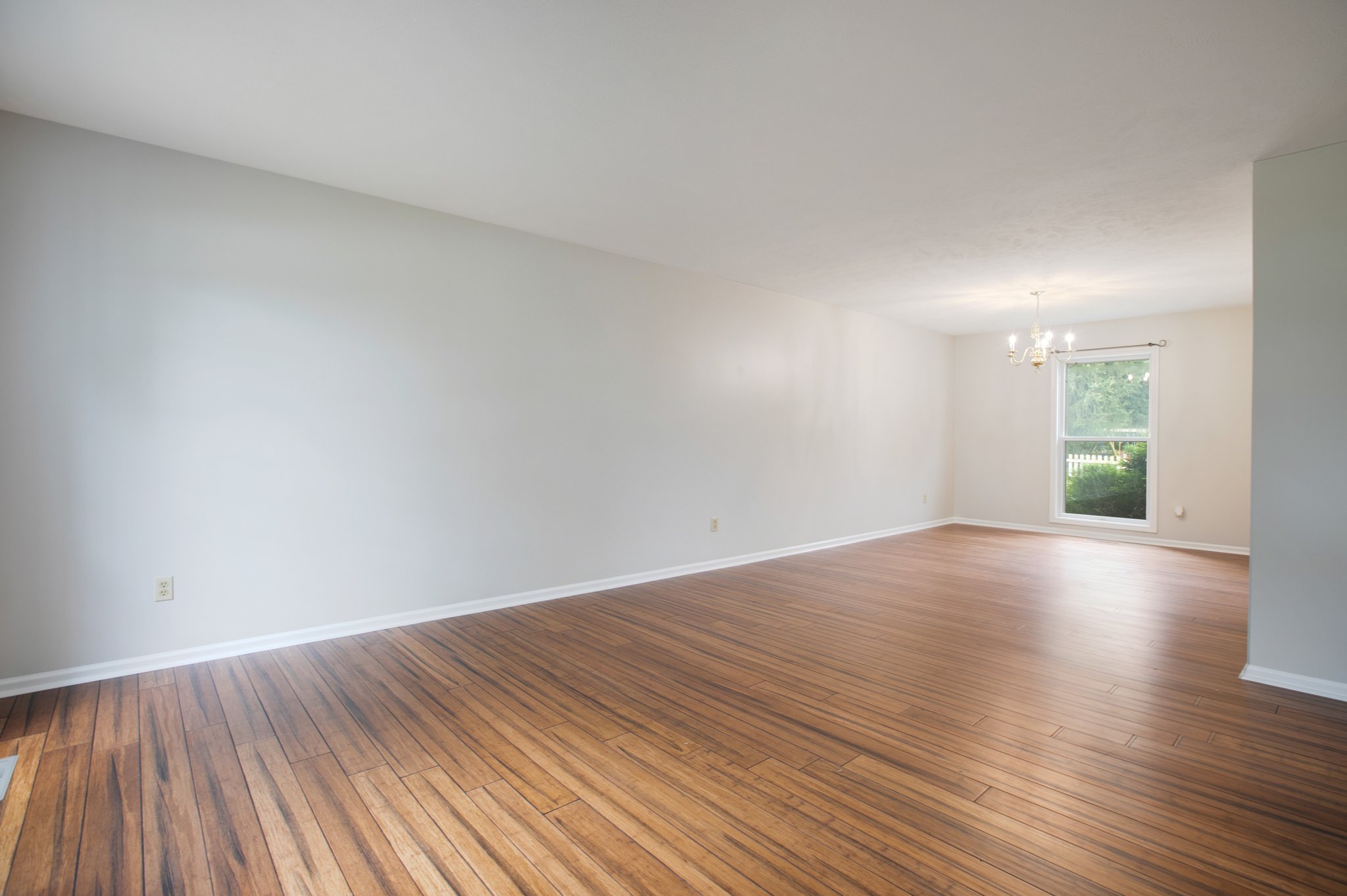 After: Dining area with original hardwood floors restored — 54347 Sagewood Mishawaka