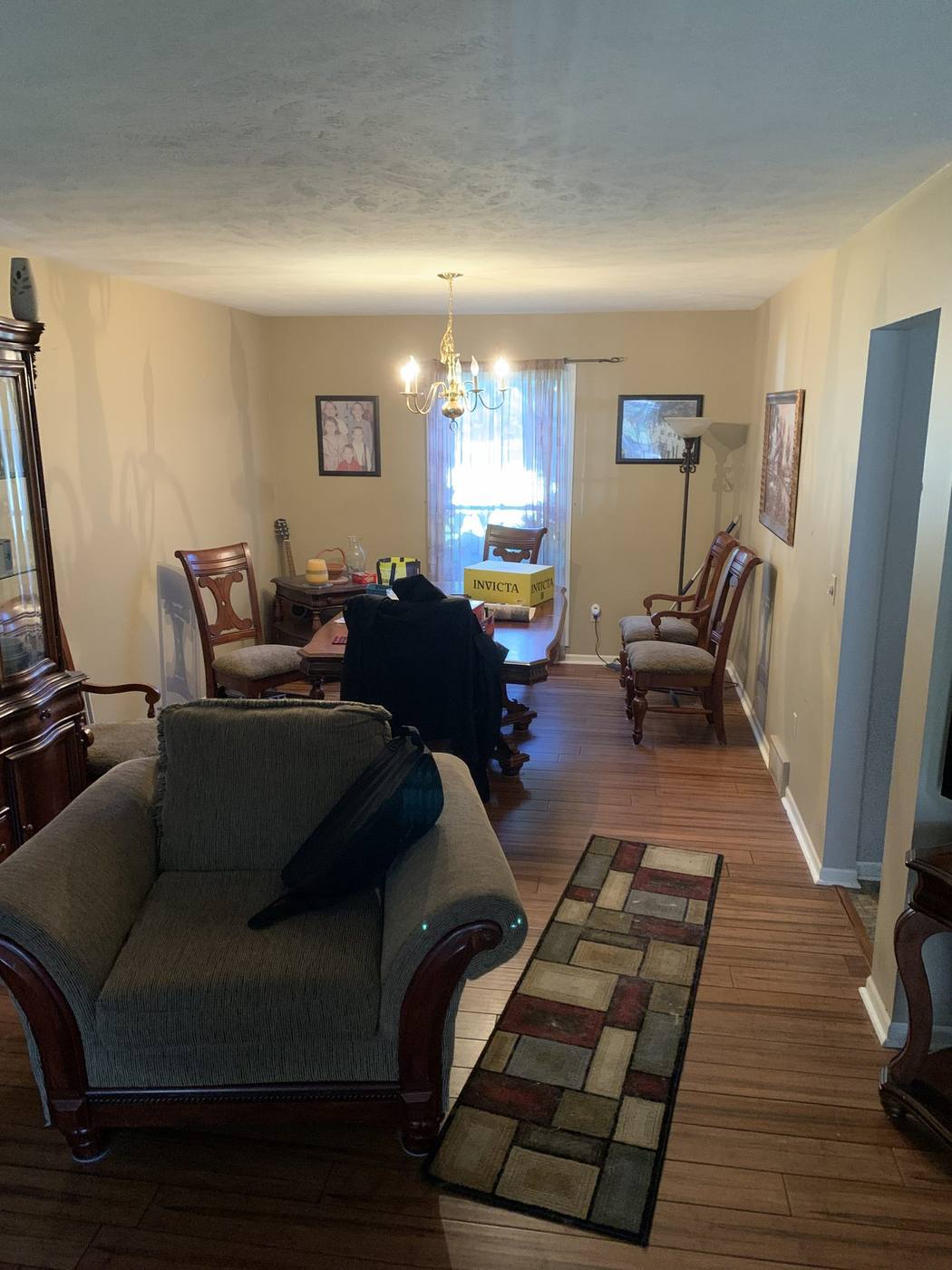 Before: Dining and living area with original finishes — 54347 Sagewood Mishawaka