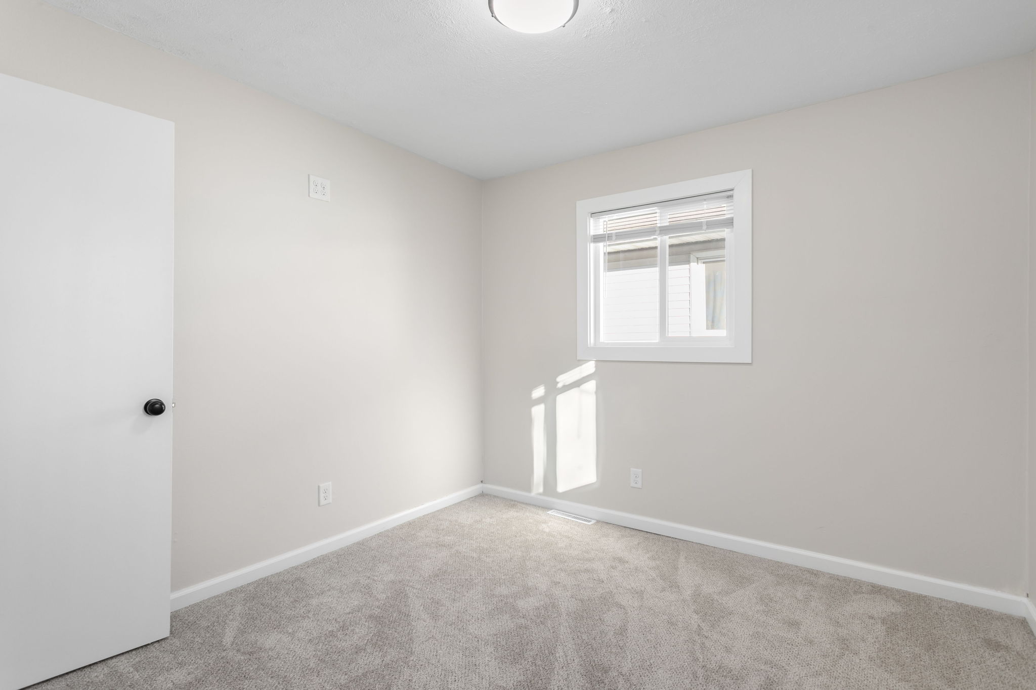 After: Renovated bedroom with new carpet — 906 Hendricks Mishawaka
